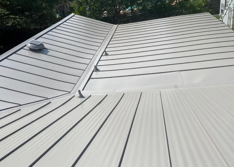 Solar attic fan installed on a metal roof for Roof Ventilation in Atlantic City